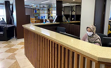 Receptionist helping clients at the front desk